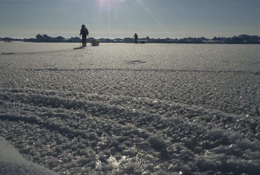 Two North Pole trekkers ski across frozen ocean in the Arctic.