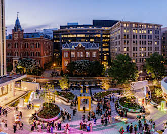 An overview of the National Geographic Courtyard at night.