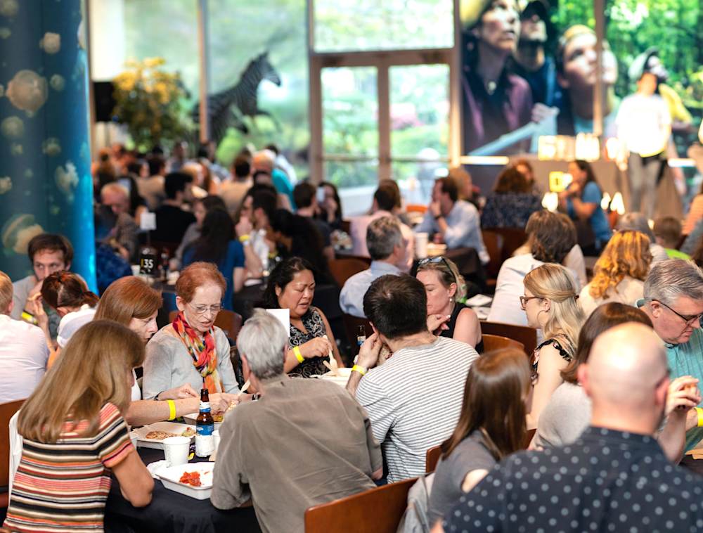 Groups of people around tables at National Geographic Trivia Night.