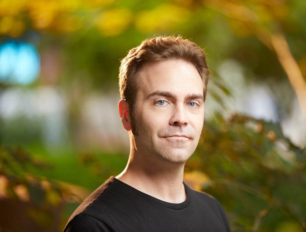 Headshot of Ryan Carney.