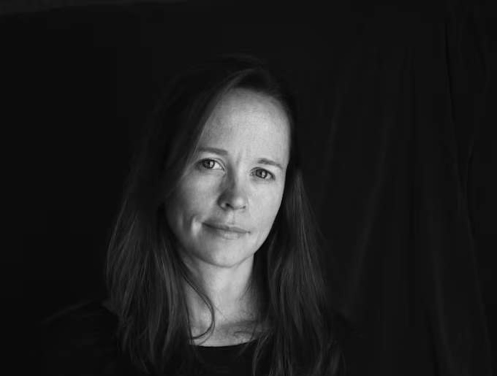 A black and white headshot of Amy Toensing.