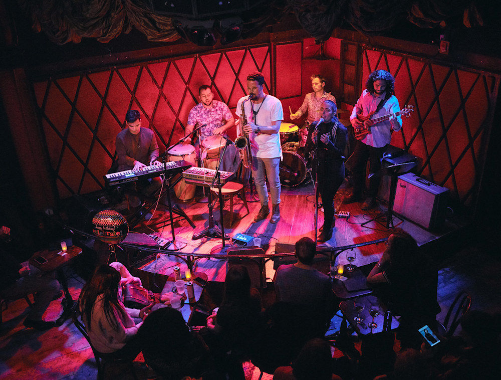 Slavo Rican Assembly performing on a stage.
