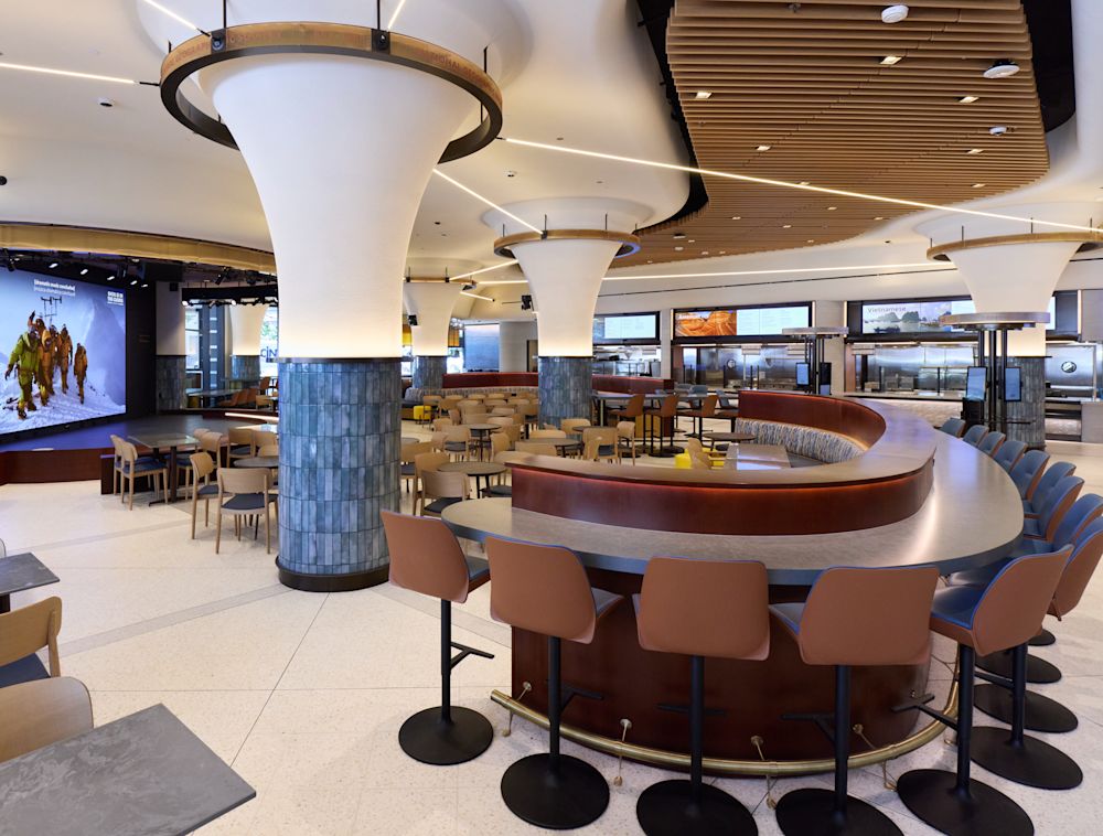 Eatery space full of tables and chairs.