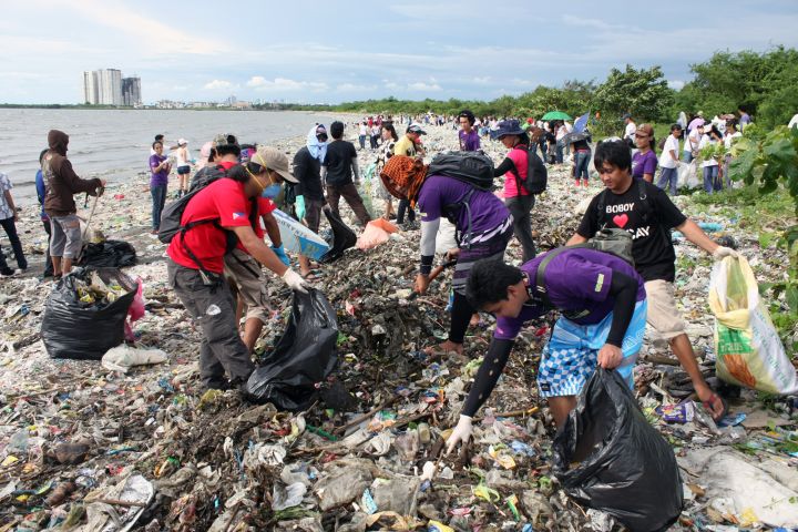 Picture of people picking up trash.