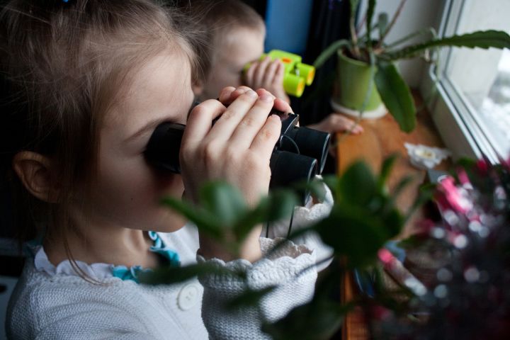 Picture of kids with binoculars.