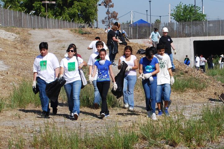 Photo of people picking up trash.