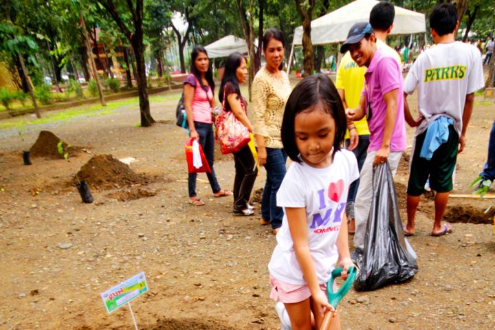 Photograph of people planting trees.