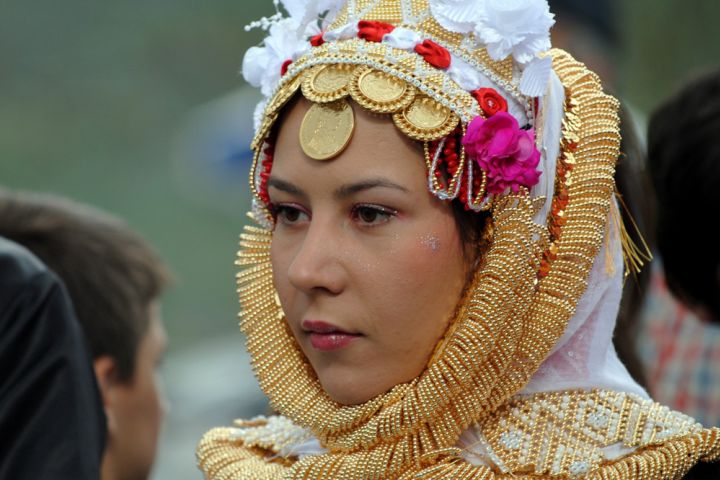 Photograph of woman in a folkloric headdress.