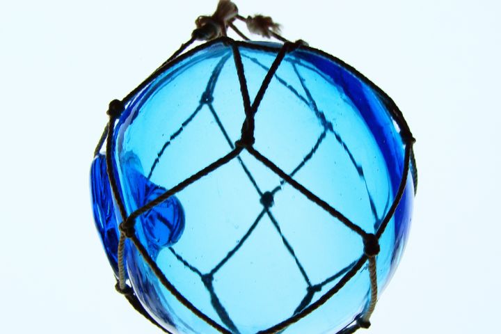 Photograph of a glass window ornament.