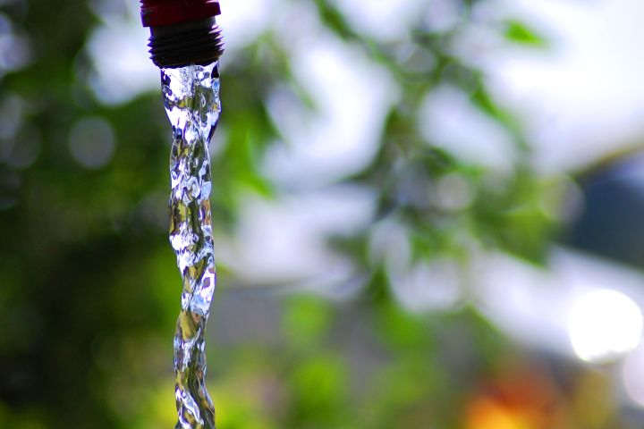 Picture of water running out of a faucet.