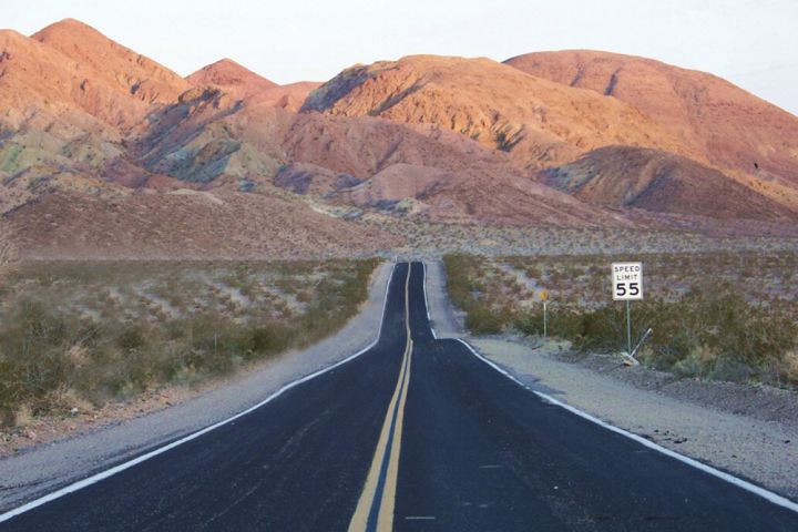 Photograph of a road in the Mojave Desert.