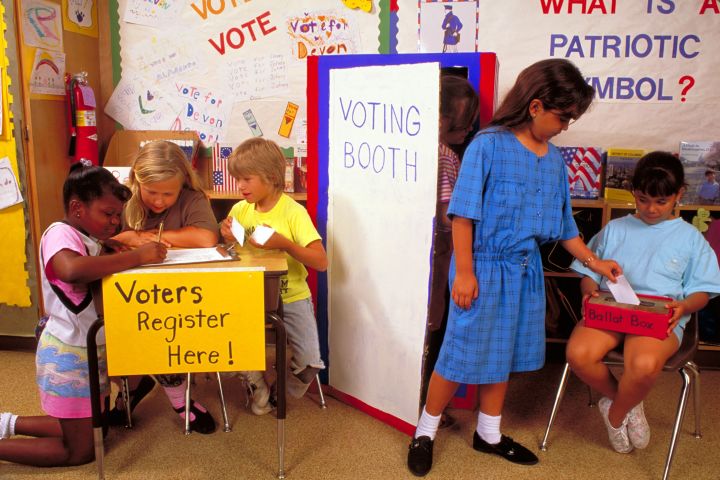 Second grade students practice voting in Elementary school