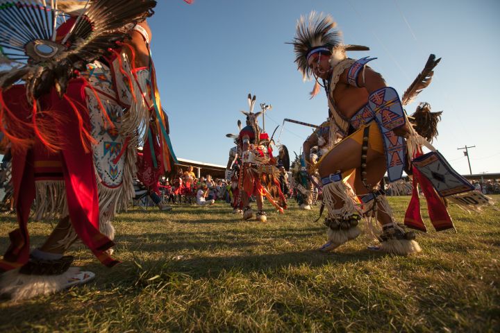 Participants dance in traditional regalia during the annual pow wow at the Crow Indian Reservation