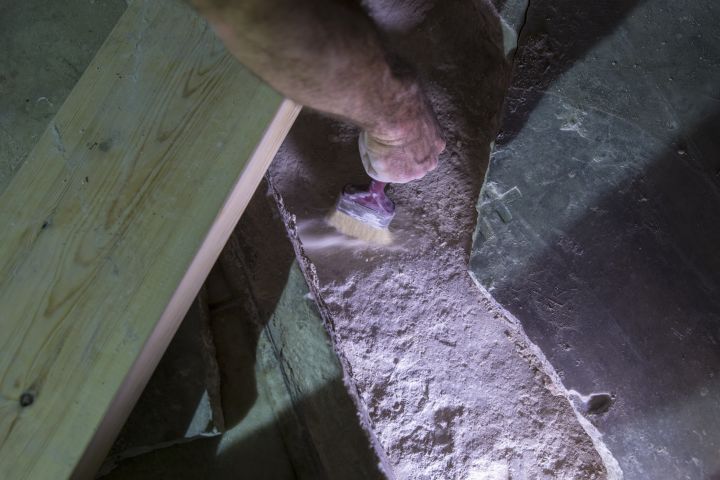 A restoration worker examines some stonework in the Church of the Holy Sepulchre in Jerusalem's old city.