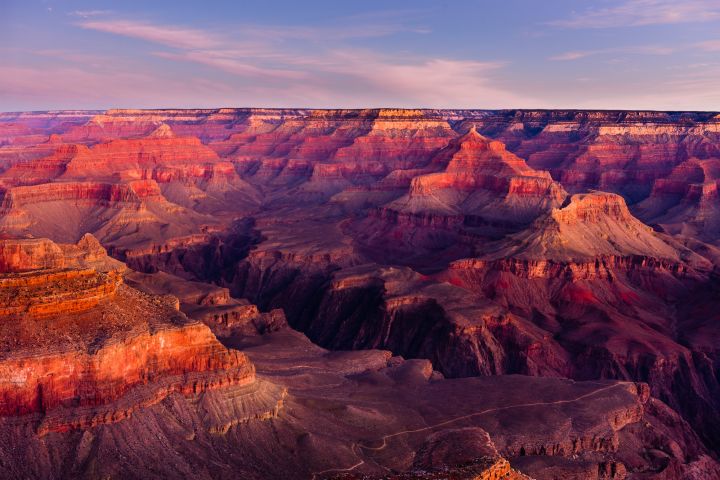 The sun highlights the stratigraphic layers of the Grand Canyon in Arizona in this image.