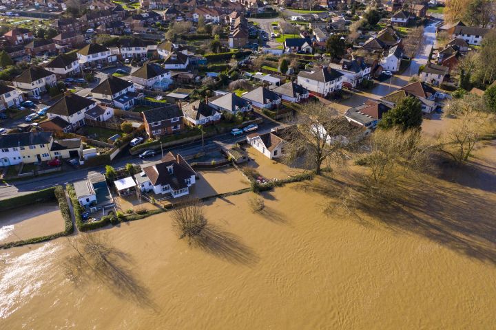 Aerial view of houses partially flooded with water in the United Kingdom