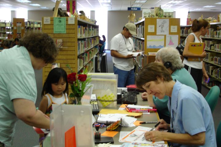 Photo of people in a library.