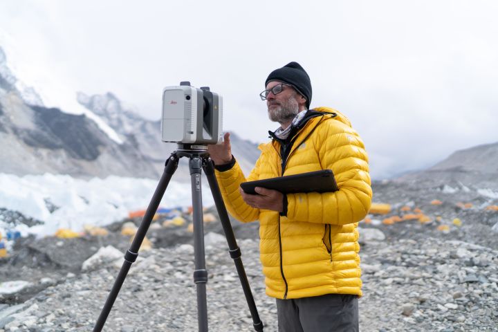 Explore careers in geography and GIS. Here, National Geographic Society Geographer Alex Tait surveys Mount Everest, Nepal, during a May 2019 expedition.