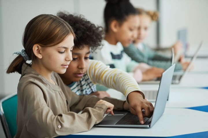 Students working together on a computer.