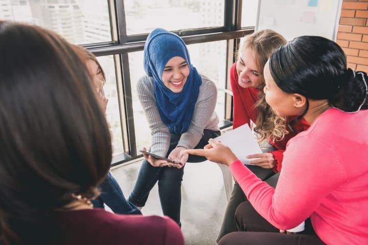 Young women having a discussion.