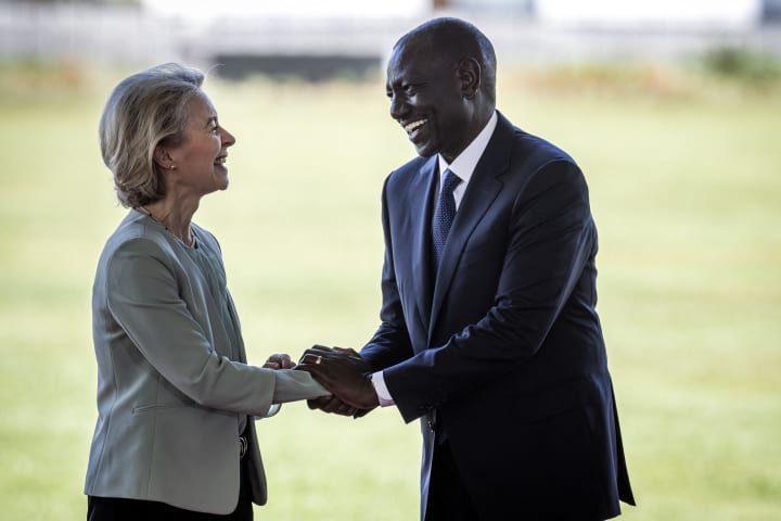 William Ruto, Kenya's president, and Ursula von der Leyen, president of the European Commission, shake after signing of a new trade agreement.