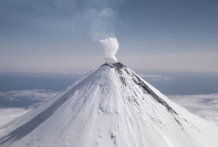 Photo of a snowy volcanic peak.