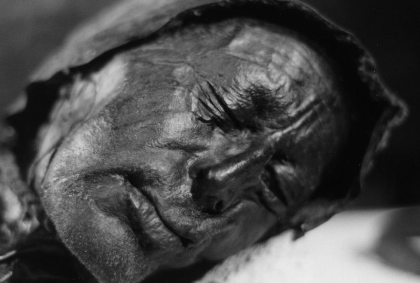 Black and white photograph of a long-deceased man found in a northern European bog. 