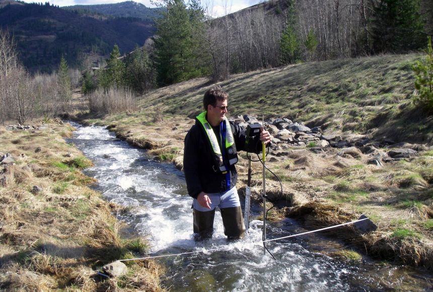 A hydrologist measures the stream flow in a tributary to the Coeur d'Alene River.