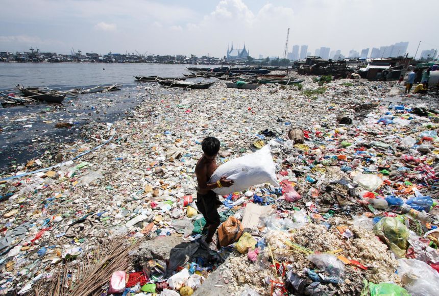 Recyclable waste is collected at the edge of a river in the Philippines. Recyclable waste often goes unused and turns into dangerous ocean pollutants.