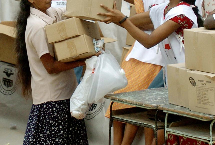 Cooperation is one form of relationships between international bodies, often nation-states. This is often seen if one place suffers from a disaster. A victim of a tsunami gets supplies from Red Cross workers in Galle, Sri Lanka, in January 2005.