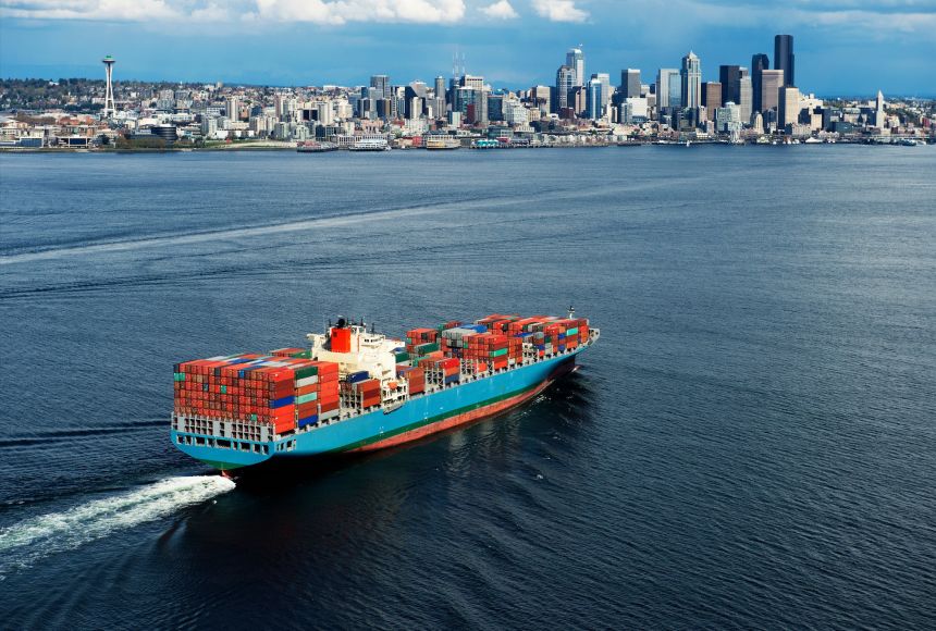 One way to calculate gross domestic product is comparing imports bought versus exports sold. A container ship heading into the United States port at Seattle, Washington.