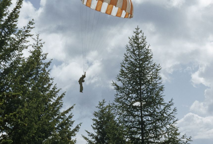 Smokejumpers are firefighters who parachute into hard-to-reach areas to fight fires. The smokejumper shown here is taking part in a training operation.