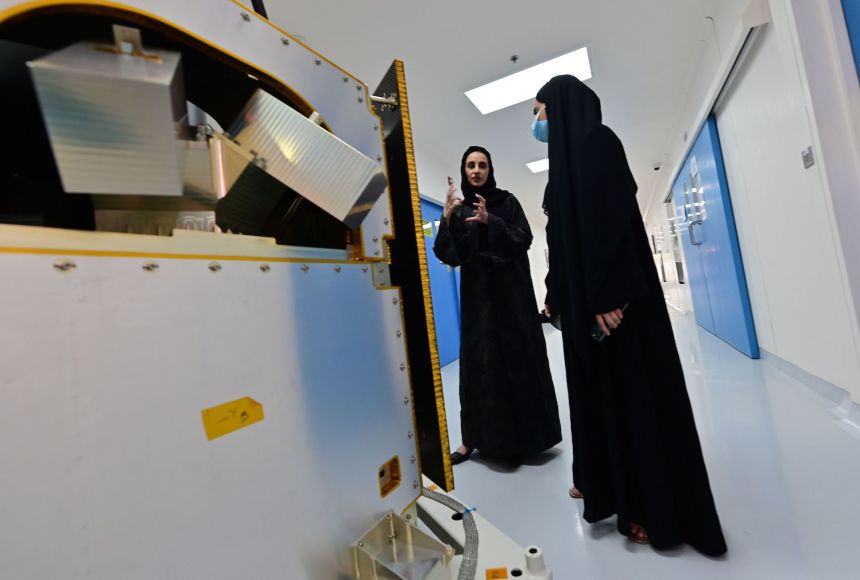 In the Gulf States women account for about 60 percent of engineering students. Here, engineers the Gulf State of Dubai, United Arab Emirates, look over a KhalifaSat model at the Mohammed Bin Rashid Space Centre.
