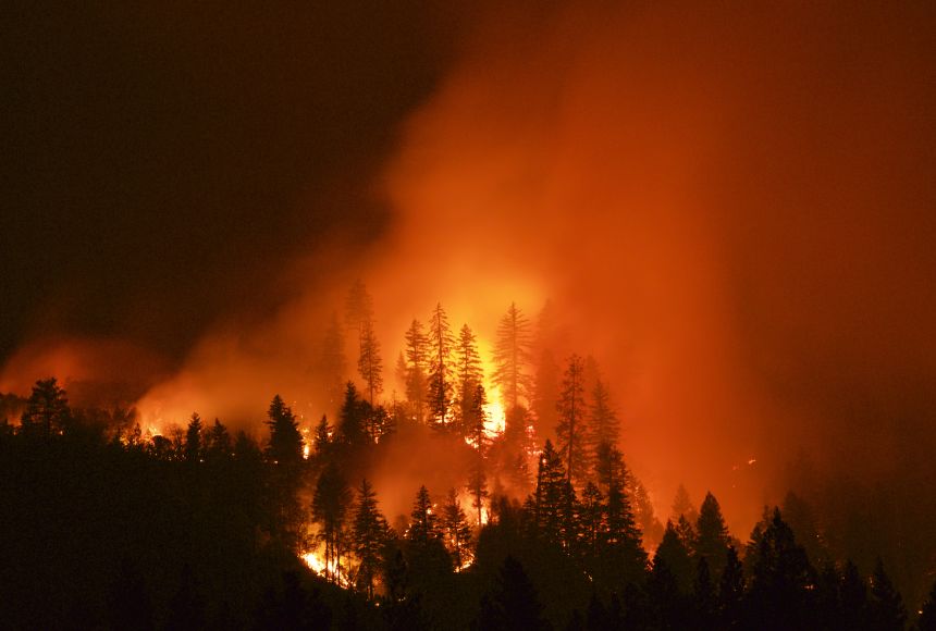 A wildfire lights the California sky at night. Many wildfires become difficult to extinguish and can permanently damage the areas they pass through.