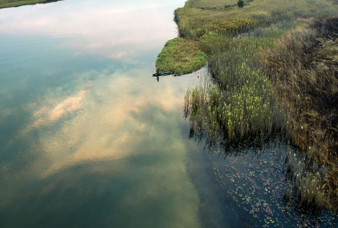 Picture of Okavango Wilderness Project team member fishing in Cuito River, 2016