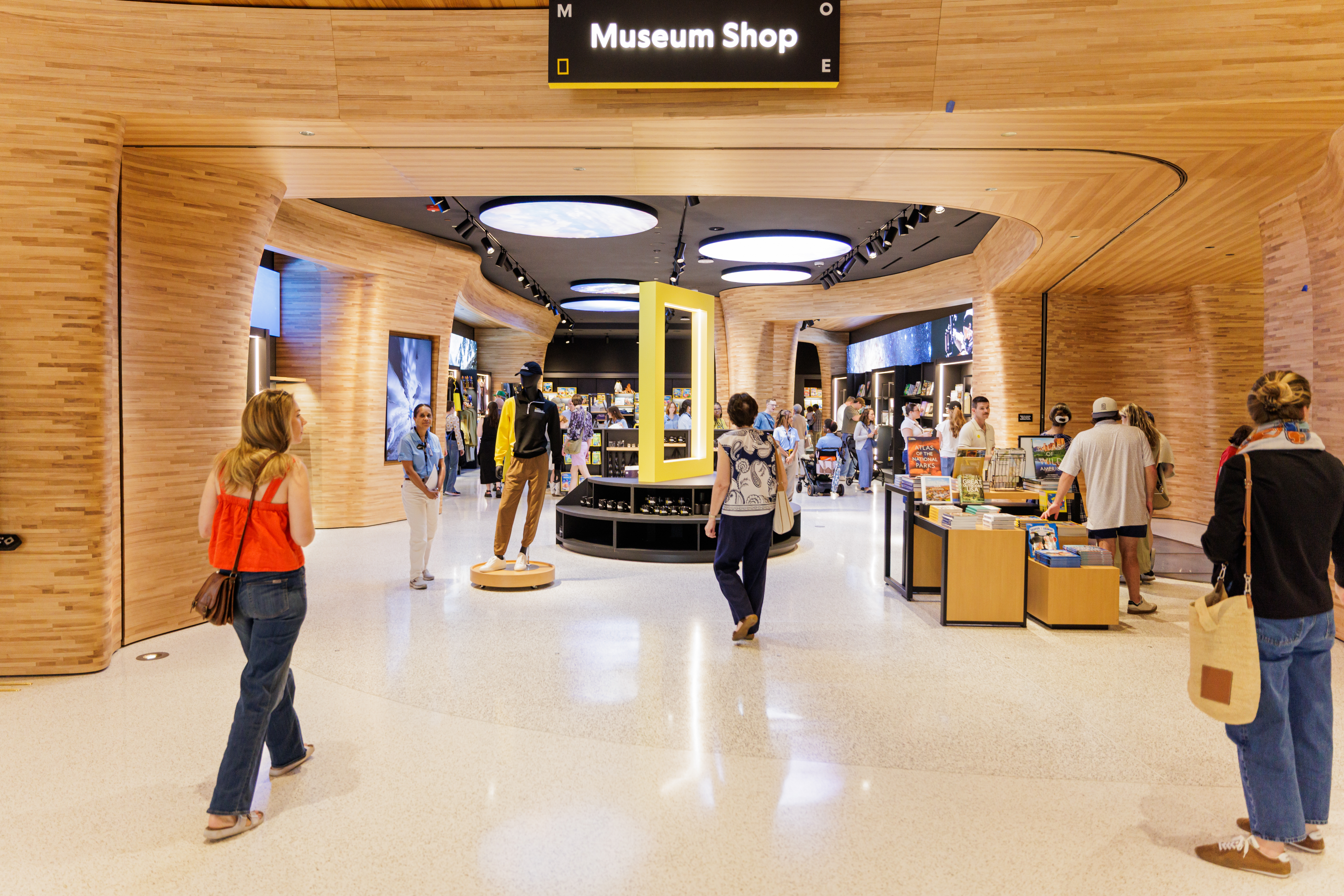 A photo shows a busy retail space full of National Geographic merchandise.