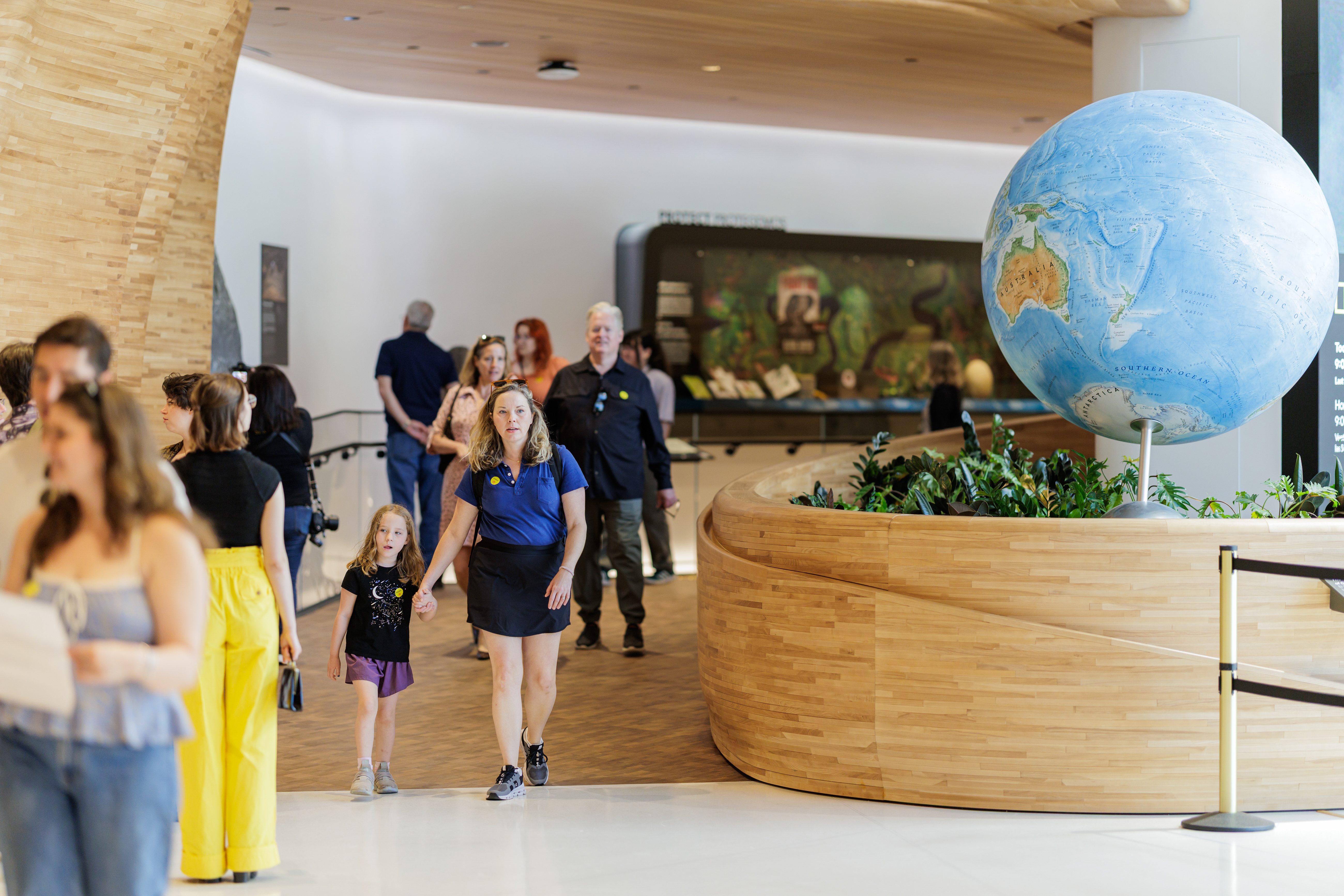 A rendering of the Museum of Exploration's Pavilion with the front desk and media wall