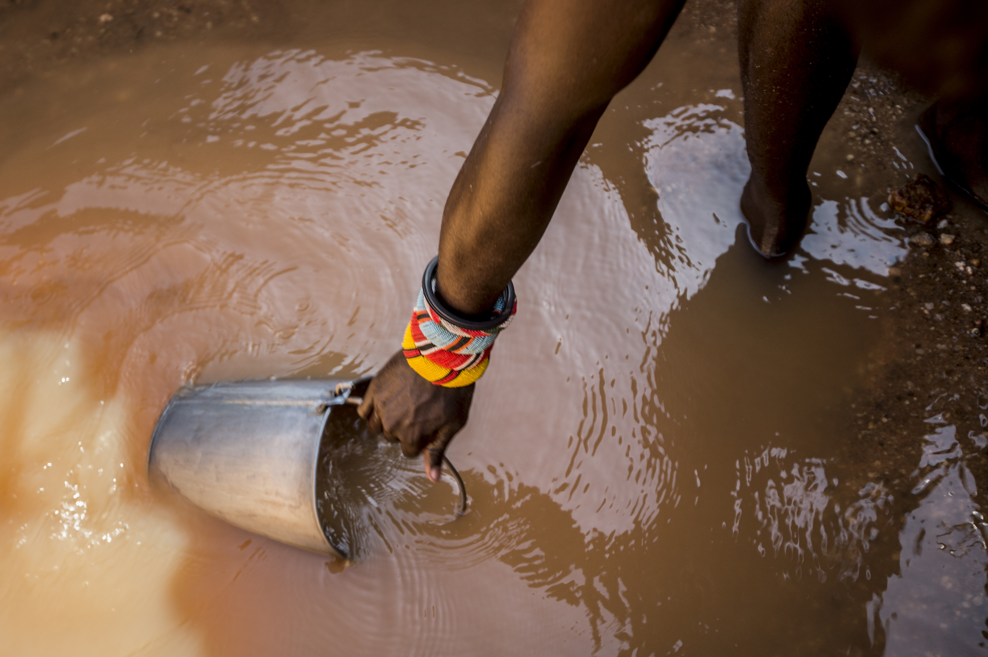 Man Running Barefoot In Water Stock Photo - Download Image Now