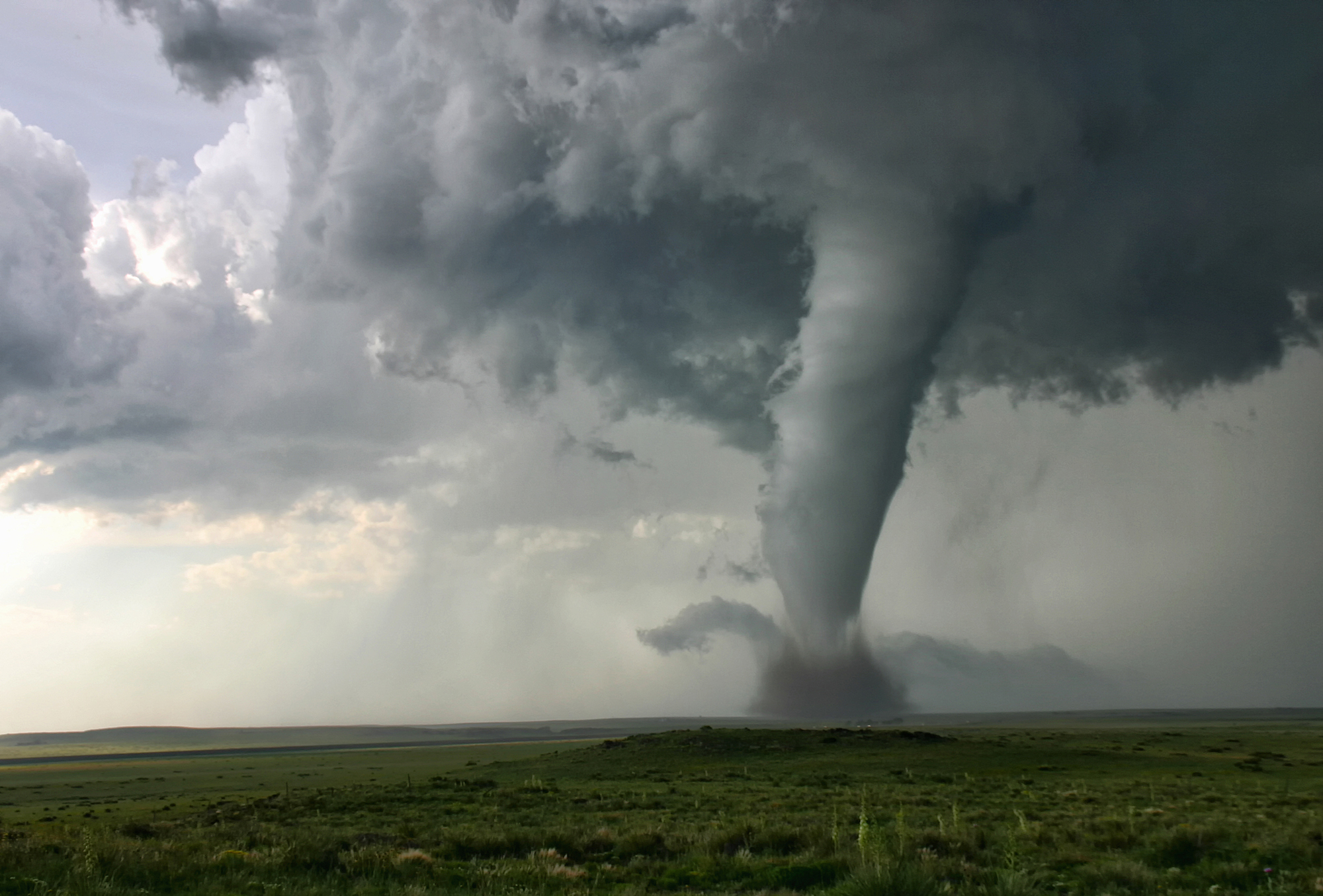 How do tornadoes and hurricanes compare?